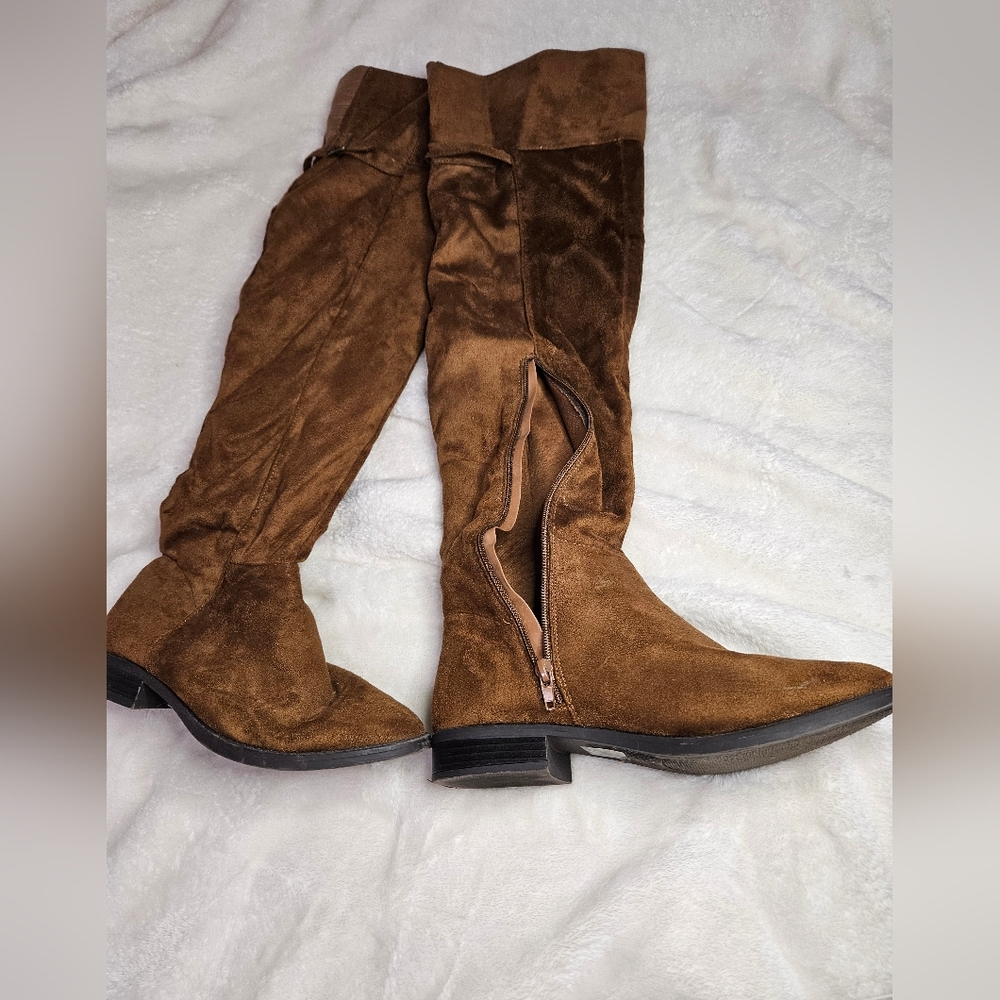 Unlisted thigh high brown suede boots.